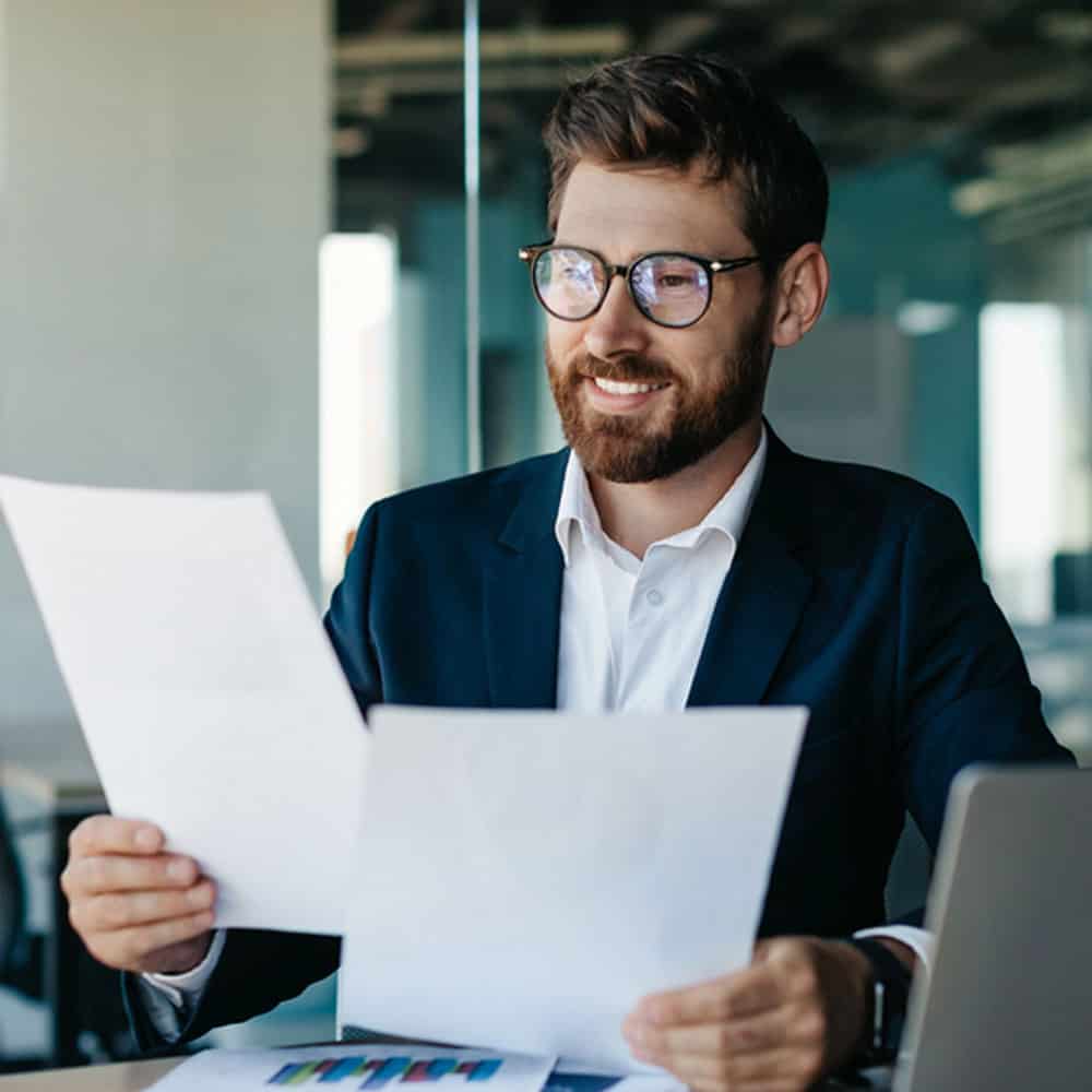 NCARB ARE Candidate studying AIA Contracts at desk