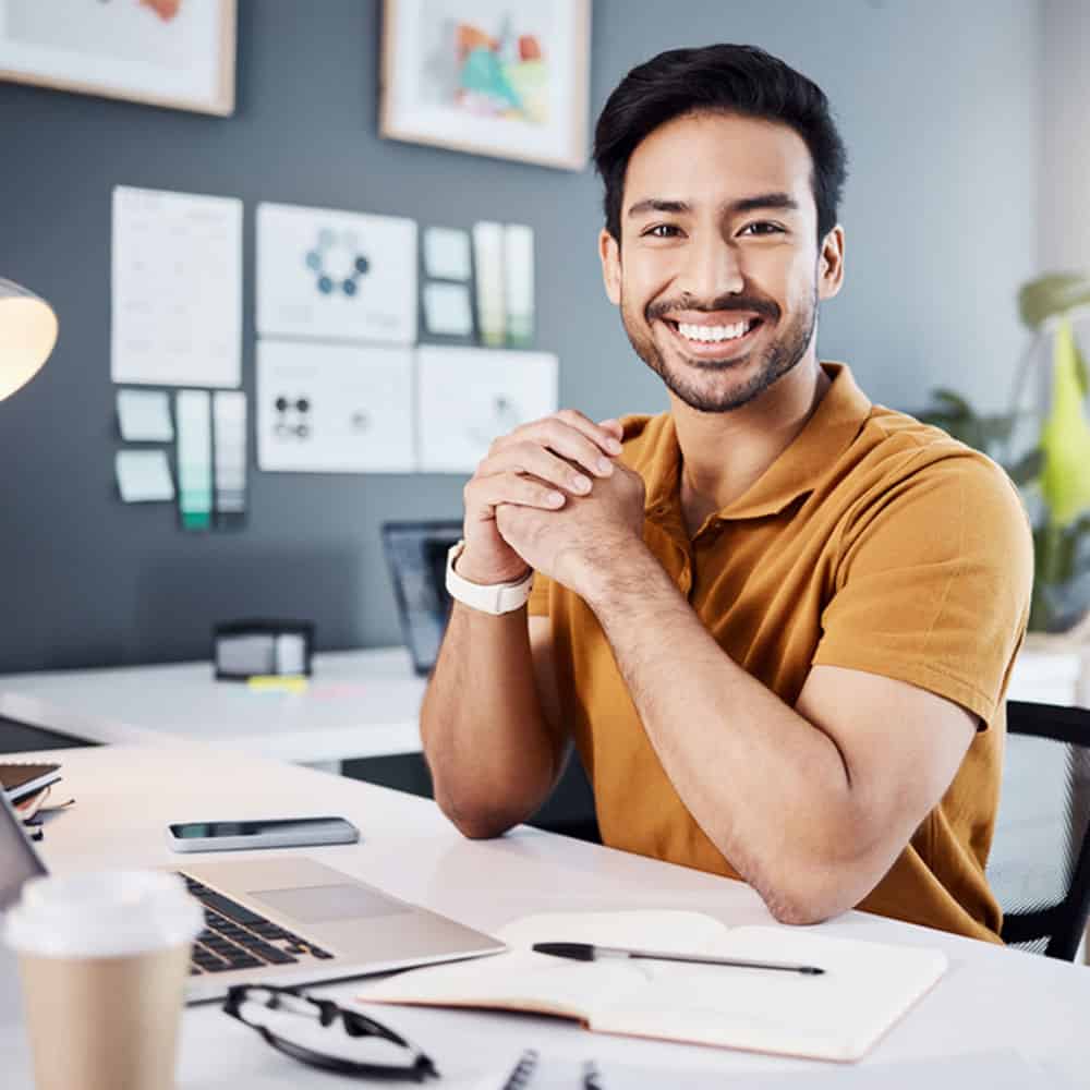 NCARB ARE Candidate studying construction and evaluation exam materials at desk