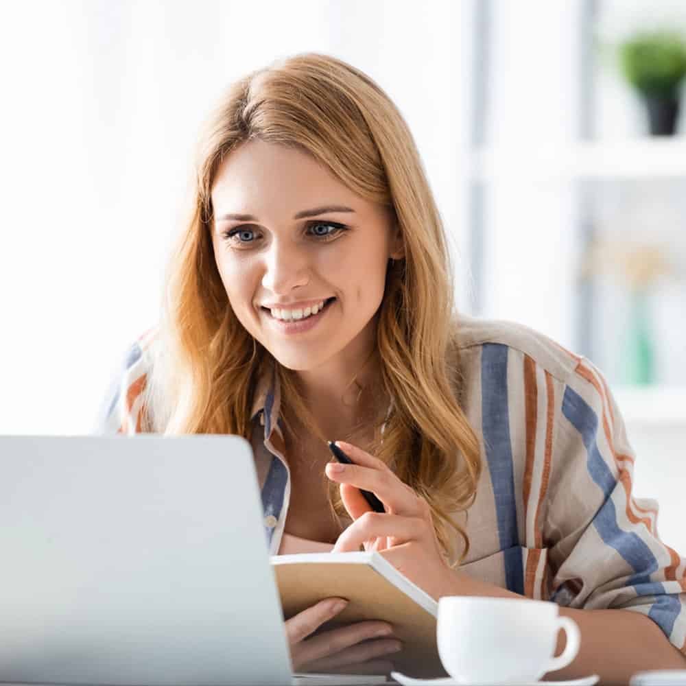 ARE Candidate studying NCARB's Practice Management exam materials at desk